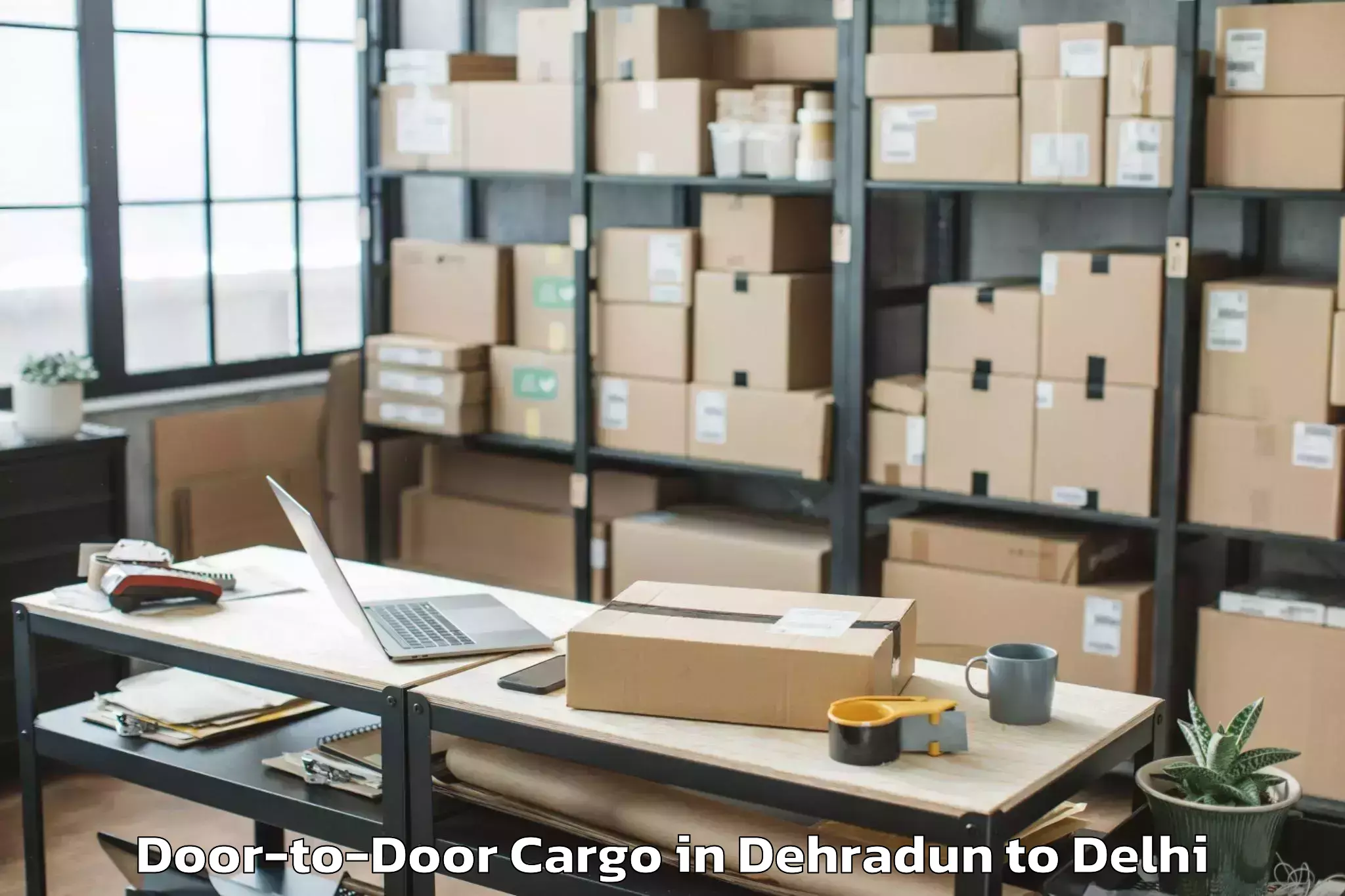 Dehradun to Unity One Janakpuri Mall Door To Door Cargo Booking